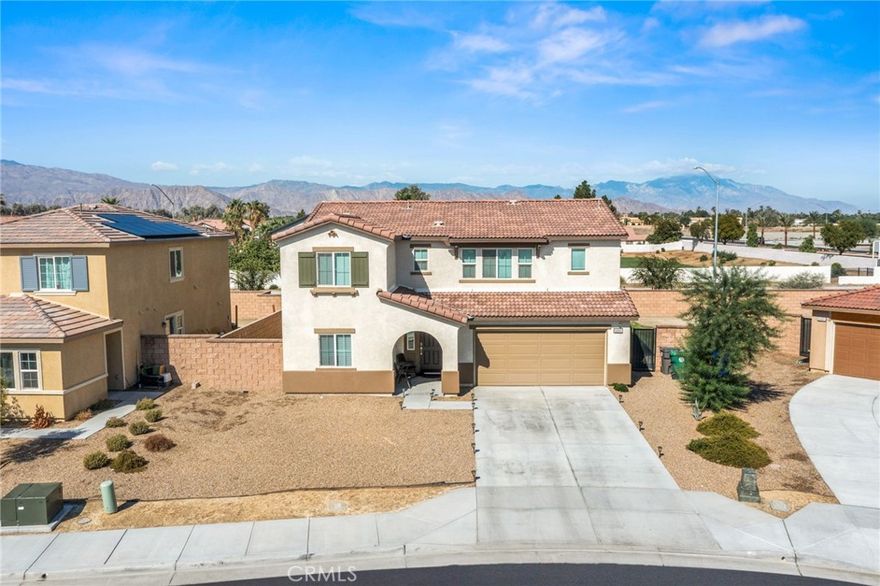 Welcome to Mariposa Pointe, one of the city of Coachella's newest communities.
This home has all that you need, if you're ready to make the move.  The kitchen features stainless steel appliances, granite counters, an island and a very open combination dining/living area for your enjoyment. There's updated hard- flooring in most of the downstairs area & carpet throughout the rest of the home. For your convenience, there's one bedroom and bathroom downstairs as well. The other 3 bedrooms and bathrooms are upstairs and all share an open/spacious loft area with endless use possibilities. The laundry room is also very roomy and has an extended large private storage room.
There's also a home-wide network of Wi-Fi enabled features and devices that you can control from your phone or a panel that's already installed in the home. **For additional savings on your electric bill, this home has a Solar Panel system leased through SunPower.
From the covered front porch, water saving landscaping in the front to the fresh clean grassy and patio ready concrete pad in the rear yard, this home is just waiting on you. Let's get you in here!