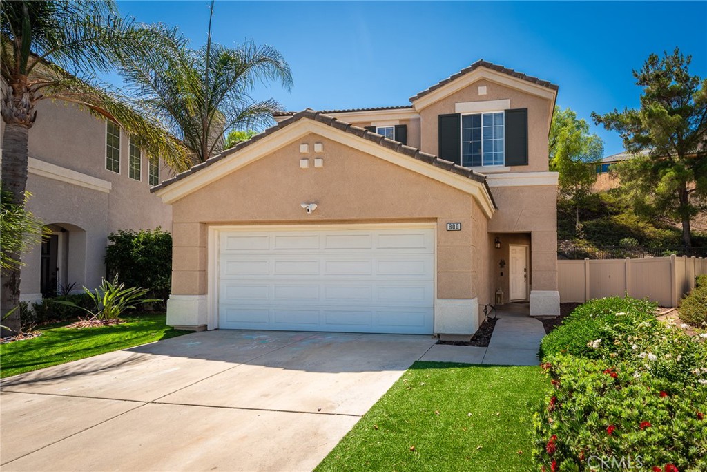 Welcome to 800 Cimarron where you will find a beautiful move in ready home showing pride of ownership and great curb appeal in a highly desirable neighborhood in the scenic foothills of Corona! Located in a lovely community featuring a community a pool and spa.
Great open layout with vaulted ceilings, a half bath downstairs, and a cozy fireplace and alcoves for decor in the living room. All bedrooms and 2 bathrooms are located upstairs. The well appointed kitchen is perfect for cooking and entertaining and features a center island and stainless steel 6 burner stove, microwave, and dishwasher just installed in 2024! Main bedroom suite features vaulted ceilings, a spacious bathroom and a walk in closet with a great closet organizer and shoe cabinet. The other two bedrooms share their own bathroom with a tub and shower. Convenient upstairs laundry area on the second floor. Outside you will find a relaxed private yard with no one behind you, only a view of nature and the landscaped hillside, plenty of room for entertaining or just relaxing in the shade under the patio cover. Newer artificial turf was recently installed in this good sized yard. The exterior of the home has been recently painted. Award winning Corona-Norco school district. Home is located near plenty of shopping, great restaurants and commuter friendly near the 15 and 91 freeways. This home is turnkey! Come see it today, before it's sold!