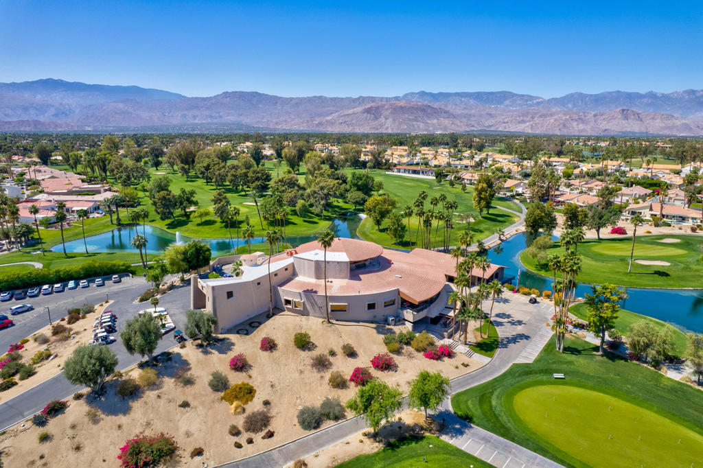 Located in a cul-de-sac close to the Avondale Clubhouse and golf course, this prime location features a home that has been completely modernized. Luxury and comfort combine to create the ultimate in Desert Living. The interior features an open, airy floor plan with the highest quality details throughout. The DREAM Kitchen featuring a handcrafted professional BlueStar 48'' cooking range with double ovens and griddle, custom designed cabinets and sleek CAMBRIA Quartz countertops with a Waterfall edge and counter seating is centrally positioned for easy meal prep and entertaining. Gencore luxury Vinyl flooring, custom plantation shutters on energy efficient windows and sliding doors, California Closet storage with built-ins and the list goes on capturing details showcased throughout the interior. Relaxation is key and enjoyed in the living/dining area featuring a wet bar, wine cooler, large seating area with floor-to-ceiling quartzite gas fireplace and multiple sliding glass doors for easy access to the outdoors. The Primary bedroom is private with an exquisite ensuite featuring unique Blue Bahia granite countertop, frameless glass walk-in shower and freestanding tub with waterfall filler all designed to capture a Spa-like experience. Two spacious guest bedrooms in the main house have been beautifully enhanced and share a sleek ensuite with custom finishes. Furnishings are available. The private, freestanding Casita offers almost 500 sq ft of comfort with the convenience of a kitchenette and sitting area that is perfect for family, guests or home office. The 2 + golf cart garage features epoxy flooring, Universal EV charger and custom cabinetry with lots of storage. The low maintenance outdoor living space allows more time for relaxation around the sparkling salt water pool, spa and expansive covered patio designed for easy entertaining with family and friends. Social amenities include dining, fitness, sport courts, doggie parks and social activities for all to enjoy within the beautiful grounds and rich history of prestigious Avondale Country Club.