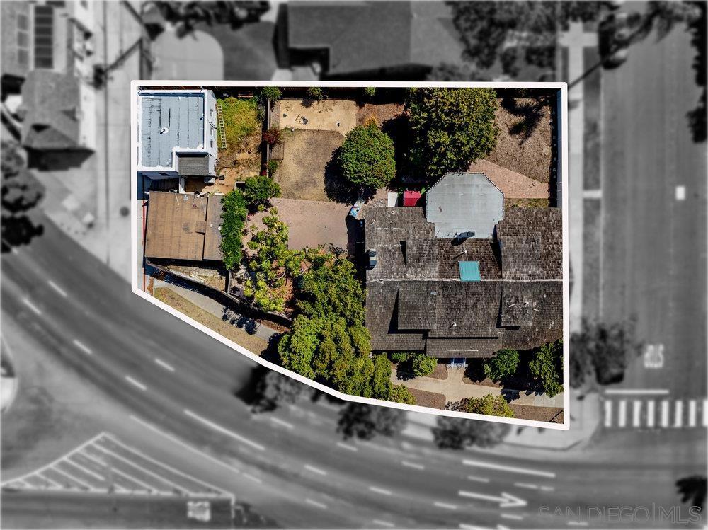 This rare offering includes two parcels being sold together, creating one of the largest residential lots currently on the market in Coronado. The combined size opens the door to a wide range of possibilities—live in the existing home while securing permits, design and build your dream estate, or subdivide and develop multiple residences. Whether you envision constructing three separate homes, selling off individual lots, or living in one while selling the others, the value per lot becomes incredibly compelling. The existing home offers 3,712 square feet with 4 bedrooms, 2.5 bathrooms, and an optional 5th bedroom. It’s filled with character, charm, and an easy coastal vibe. The layout is spacious and flexible, perfect for everyday living or entertaining. This is a rare blend of space, location, and potential in Coronado. Use the home as-is, or take advantage of the significant development options available (buyer to verify). Whether you’re seeking a private retreat with room to grow or a unique opportunity to build and invest, this property offers unmatched potential.