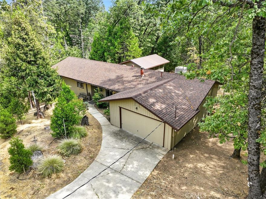 Not one, but four parcels are included in this sale, making it one of the largest properties in the serene development of Cascadel Woods. This peaceful mountain community offers fishing ponds, creeks, waterfalls, and the charm of a tight-knit, fire-wise neighborhood.Inside, enjoy the warmth of a cozy wood-burning stove in the winter, while the large detached screened-in porch provides a relaxing retreat during warmer months. The private backyard borders community land, ensuring privacy, abundant wildlife, and direct access to a seasonal creek and fishing pond.The home has its own private well, while one of the adjoining parcels is already hooked up to community water and equipped with a septic system. Ownership includes guaranteed membership in the Cascadel Mutual Water Company, which covers road maintenance and snow plowing. Property will be sold as is. Don't miss your chance to own almost 2 acres of paradise.