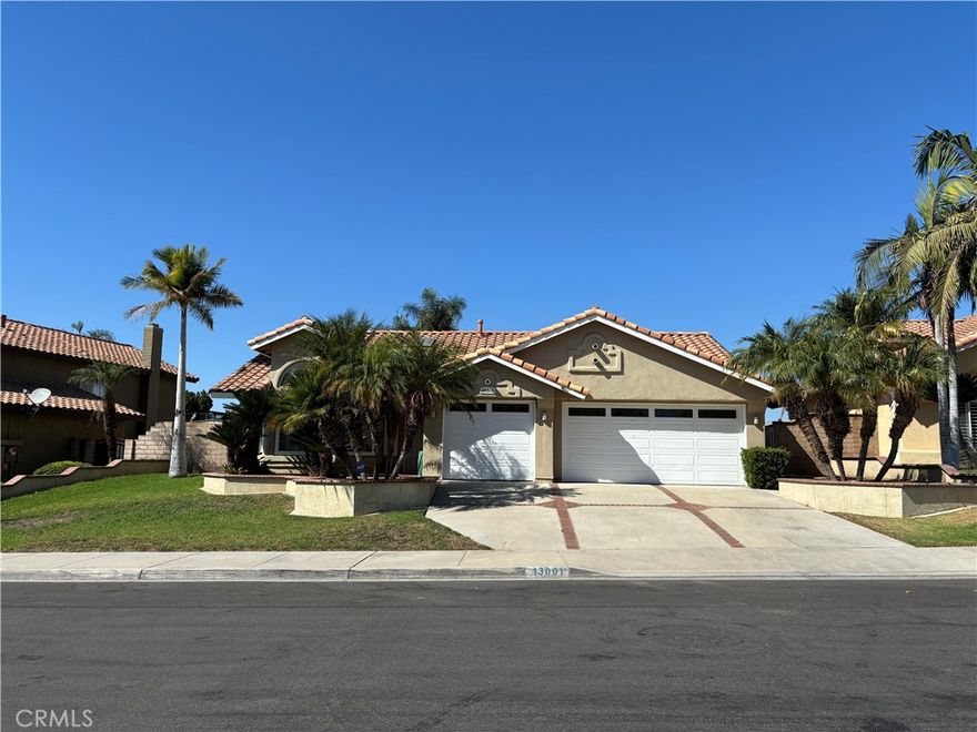 A fabulous single story home with views, located in the sought after "Four Seasons" community, next to Corona Hills! 4 bedrooms, 2 baths, 3 car attached garage--all on one level without any interior steps. Very spacious living room with high ceilings and a custom walk-in bar. The gourmet kitchen offers granite countertops, a huge island with bar sitting, a newer stove with 4 burners & a griddle, and an oven with self-cleaning feature. Charming family room features a cozy fireplace and a door to the patio. The dining area with a ceiling light/fan is just off the kitchen. All bedrooms are of a great size and have a ceiling fan/light. The luxurious primary suite boasts his and her walk-in closet, a patio door, and an en suite bath with a separate shower and tub, dual sinks, etc. Two of the three secondary bedrooms have a large closet. Newer water heater. Beautiful tile flooring in entry, living room, family room, hallway, baths, and kitchen. Individual laundry room with built-in cabinets. 3 car attached garage has a direct access to the house. Central AC and heating. Beautiful curb appeal. Enjoy the mountain views in the large backyard! The HOA amenities include pool, spa, 2 tennis courts, etc. Conveniently located off MCKINLEY exit off 91 Fwy. One exit to 15 Fwy. Short drive to Kaiser Riverside, downtown Riverside, Mission Inn, etc. Super clean! Call today!