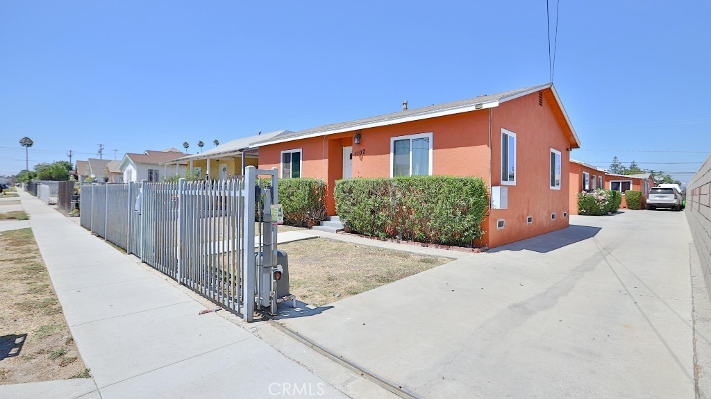 This fully gated property features three separate homes on one lot, each rented and generating steady income. Two units are 2 bed / 1 bath and 2 bed / 1.5 bath, and the third is a 3 bed / 1 bath. Recent upgrades include new flooring and cabinets in two units, updated electrical panels, copper plumbing, dual-pane windows, granite kitchen counters, and remodeled bathrooms—all designed to reduce maintenance costs. Each unit has its own yard, two parking spaces, and access to a total of 10 spots. Built in 1921, 1954, and 1958, the homes offer a blend of vintage charm and modern comfort—ideal for investors seeking a turnkey, low-hassle rental property. DRIVE-BY ONLY – ALL UNITS TENANT OCCUPIED.
