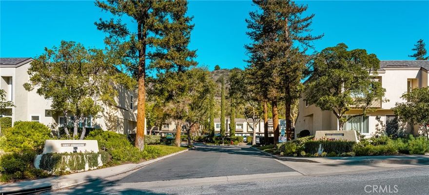 Welcome to 5927 E Creekside Avenue #32, A Beautiful Corner Unit Townhome Located in the Villeurbanne Community of Orange. This 3 Bed, 1.5 Bath Home features Modern Updates Throughout, Including New Interior Paint, Vinyl Flooring, Custom Wood Paneling and Shelving and Views of the Orange Hills. The Family Room is Light & Bright with a Cozy Fireplace & the Kitchen Features New Quartz Countertops, Stainless Appliances and a Dining Area Overlooking the Patio. The Primary Suite has a Large Closet, Dual Vanities, and direct access to the Upstairs Full Bath. Two ample-sized Secondary Bedrooms round out the Top Floor of this Spacious Condo.  Indoor Laundry Room with Washer & Dryer Included. Additional Features Include: a New HVAC system & Dual Pane Windows. Walking Distance to Community Amenities Including: A Resort Style Pool, Spa, and Club House. Short Drive to Old Town Orange (Plaza), Irvine/Peters Canyon Regional Parks, Shopping, and Dining. Easy Access to the 55/22/91 Freeways and 241/261 Toll Roads. A Great Location and a Move-In Ready 3 Bedroom Condo for the New Year!!