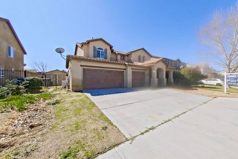 Photo of 6048 Oak Fence Lane, Lancaster, CA 93536 (MLS # PTP2501591)