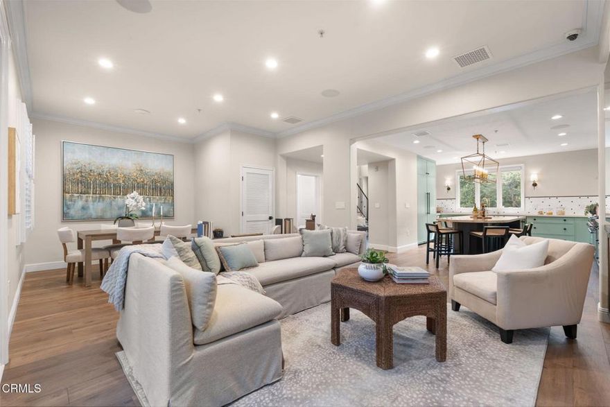 Welcome to 108 El Molino Ave #106, a meticulously updated luxury condo in Pasadena's vibrant Playhouse District neighborhood! Showcasing high-end materials and cutting-edge smart home technology, this exceptional residence offers the elevated lifestyle you've been seeking. Inside, newly added European Oak hardwood floors infuse a refined elegance throughout. The stunning chef's kitchen is outfitted with a new 48' Thermador stove and double oven, Sub Zero refrigerator and freezer with panel fronts, and a water purification system. Stunning marble countertops extend across the space, highlighted by a custom 10' x 4' island with seating for 6 and built-in storage. A newly installed $60K integrated sound, security, wifi, and media system--operable by app or voice--adds both convenience and peace of mind. The living room, anchored by a sleek electric fireplace and 83' LG flat screen, invites comfort and connection. Just outside, a shaded patio with Saltillo tiles and a custom-built Cedarwood pergola offers a peaceful setting for outdoor dining and relaxation. Three bedrooms rest upstairs, each featuring custom-designed closet systems. The primary suite includes built-in shelving and a spacious walk-in closet, while its ensuite bath has been luxuriously updated with premium finishes including a rain shower and a Toto washlet. A tankless water heater, updated plumbing, EV-equipped underground parking, and new LG washer and dryer are among the many other upgrades made to the unit. With every aesthetic and functional detail thoughtfully upgraded, this exceptional condo combines the feel of a brand-new home with the refinement of timeless design. Don't miss the chance to enjoy turnkey living, perfected.