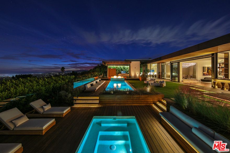 The most elegant tasteful organic modern ever built in Trousdale. Just completed over 4 year renovation and all the finishes had to be the best not done for spec! Huge scale, Explosives 270 views from downtown, ocean to the Getty center sunset. Huge sun filled back yard. Properties like this don't come often and rarely exist bring clients that are sophisticated and have an eye for style and taste.