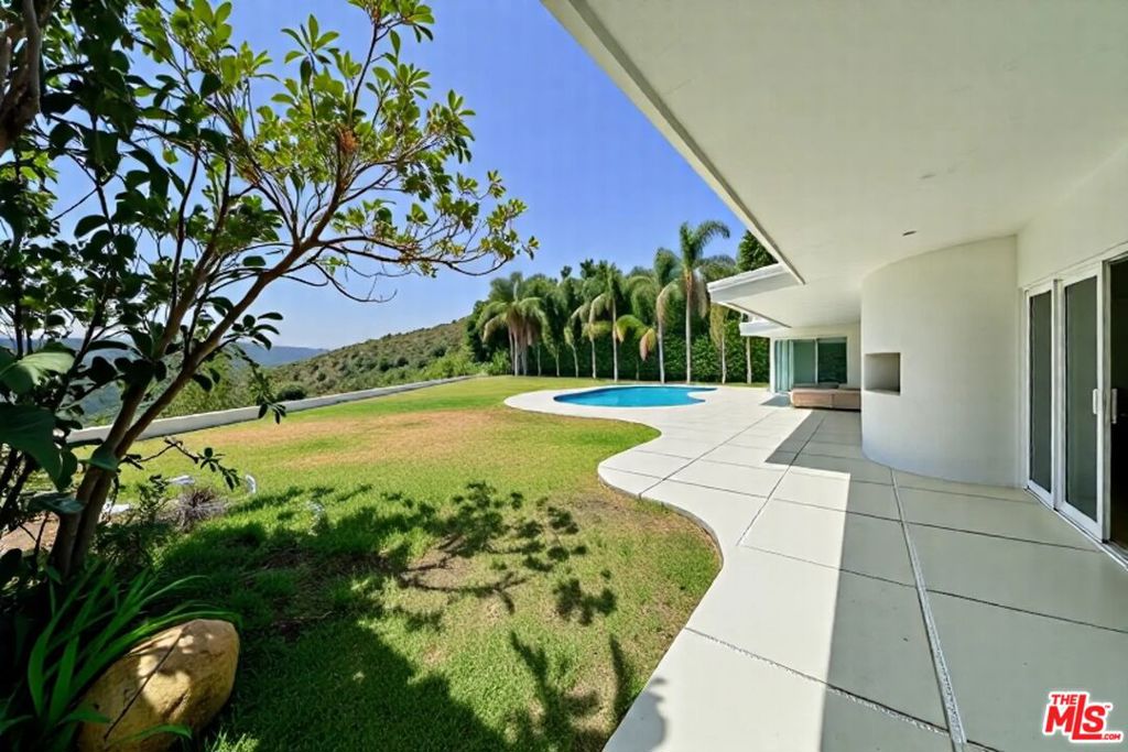Welcome to 1641 Tower Grove Drive- a stunning, sleek, single level, 3 bedroom modern contemporary exclusively located on a coveted cul-de-sac surrounded by multi-million dollar estates. Rich in privacy and tranquility this home is set behind gates and offers unparalleled dreamlike cityscape, ocean and canyon views. Extensively refined and thoughtfully reimagined to offer the quintessential california living experience. Inside, you are invited by soaring high pitched ceilings and an open floor-plan concept with living room and dining perfectly appointed with new hardwood floors, recessed lighting and large glass sliding doors and windows showcasing the seamless indoor outdoor flow of the residence. A large gourmet kitchen is a chef's dream, featuring top-of-the-line stainless steel appliances and a spacious layout designed for functionality and style. Bedrooms are spacious and abundant closet space ensuring ample storage for all your needs.Incredible rental opportunity for those who love views, privacy and the ability to entertain, the backyard is the perfect oasis to lounge, socialize and unwind. From the newly refinished pool, large grassy area and expansive lounge areas this property truly offers a tranquil environment for elevated living and outdoor experiences.
