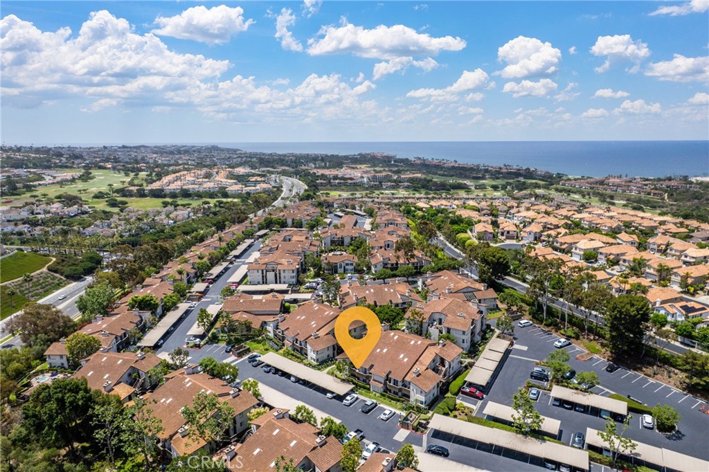 WALK OR BIKE TO THE BEACH!! Incredible opportunity at excellent price for this community! This GROUND level condo is located in the luxurious, 24 hour guard-gated community of Monarch Hills. Upgraded throughout this turnkey, corner unit features 2 bedrooms, 2 bathrooms and 1,130 square feet. Bright & clean kitchen boasts granite counter tops, & upgraded cabinetry, stainless appliances and recessed lighting. The living room enjoys a cozy fireplace which leads to private deck and laundry room. There are three separate sliding doors which lead access to the back patio. Bathrooms have upgraded cabinetry, granite counter tops and replaced low flow toilets. Both bedrooms have ceiling fans and walk-in closets. The master bedroom has remodeled shower with glass doors and design mosaic. This unit keeps you cool in Summer with central AC. There is a trolly you can ride in Summer which drops you at Laguna Beach or San Clemente for entertainment. Incredible resort like amenities include pool, spas, clubhouse and gym. One of the spas is set over looking the Monarch Beach Links Golf Course and Waldorf Astoria Monarch Beach Club and Resort with INCREDIBLE PANORAMIC AND OCEAN VIEWS!! Biking trails just outside of the community or walk the trail to Salt Creek Beach!!! Close to Dana Point Harbor, Ritz Carlton, dining and shopping!!