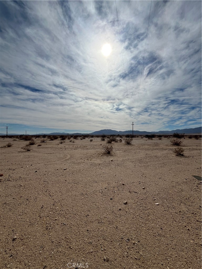 Discover this exclusive parcel in the thriving 29 Palms community, presenting a prime investment opportunity and an unbeatable offer on build-ready land with great mountain views and power on the edge of the property. Located just minutes from the Marine Corps base, hospital, airport, and shopping centers, this property offers both convenience and potential. For those looking to escape city life, this private location is just a quick drive from the Joshua Tree National Park. With 29 Palms' unique mix of natural beauty and strategic location, this is not just an investment – it's your chance to own a slice of paradise. Don't let this extraordinary opportunity pass by.