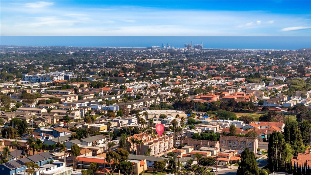 Experience the ultimate coastal lifestyle in this beautifully upgraded townhome offering over 1,500 sq. ft. of thoughtfully designed living space in the heart of Huntington Beach. Perfectly positioned just a short distance from the sandy shores and lively downtown, this 2-bedroom, 2.5-bathroom retreat blends modern comfort with beachside charm. Enter on the ground level where you’ll find a spacious 2-car direct-access garage with a pristine epoxy finish, as well as a dedicated laundry room for added convenience. Just beyond, step out to your private ground-floor patio—an inviting oasis featuring a relaxing new hot tub, perfect for unwinding after a day at the beach or entertaining under the stars. Ascend to the second floor and step into an inviting open-concept living and dining area, where vaulted ceilings and expansive windows fill the home with natural light. Enjoy cozy evenings by the gas fireplace, showcase your favorite décor on custom built-in shelving, and entertain with ease in the upgraded kitchen featuring sleek countertops, stainless steel appliances, and ample cabinetry. A stylish powder room on this level adds functionality for guests. Upstairs, you’ll discover two luxurious master suites, each boasting vaulted ceilings, spa-inspired en-suite bathrooms, and generous closet space—ideal for creating your own peaceful retreat. The true crown jewel of this home is the expansive private rooftop deck, where you can unwind, savor breathtaking sunsets, and enjoy ocean breezes just minutes from the beach. With newer laminate flooring throughout, thoughtful upgrades, and an unbeatable location near shops, restaurants, and Huntington Beach’s iconic coastline, this townhome is the perfect blend of style, comfort, and convenience.