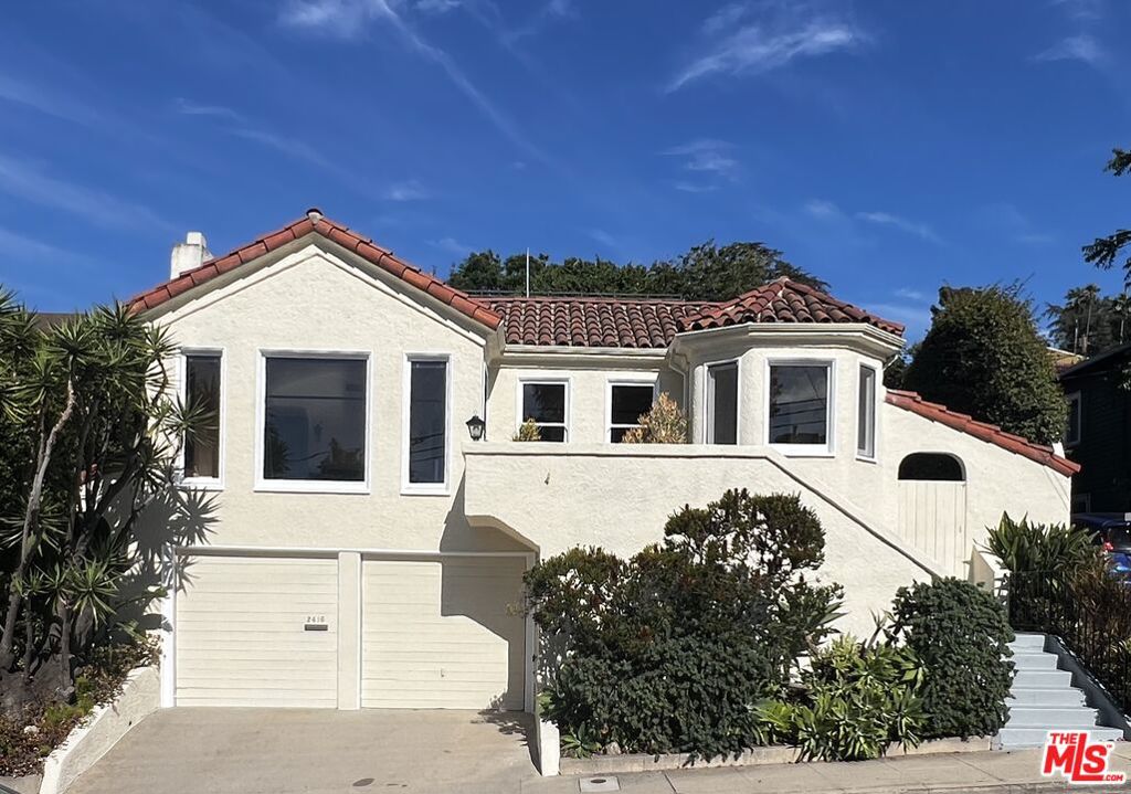 Step into timeless Silver Lake charm with this 1929 Spanish-style bungalow, blending historic character with modern potential. Featuring 2 bedrooms and 1 bath across 1,101 sq ft, the home welcomes you with arched doorways, hardwood floors, and abundant natural light. The living and dining rooms flow seamlessly, creating a cozy yet open feel perfect for entertaining or relaxing evenings at home. A vintage tiled bath with a striking arched shower entry adds to its unique character. Offering a two car garage, workbench and storage space. Set on a low-maintenance 2,500 sq ft lot, the property offers simplicity and convenience while keeping you close to Silver Lake's best amenities. Enjoy morning coffee at nearby cafes, boutique shopping, and easy access to the reservoir walking paths. With undeniable charm and a highly desirable location, this home is a rare opportunity to own a piece of LA history.
