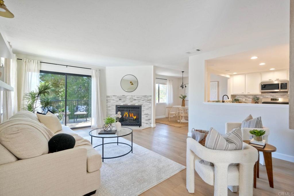 Step into this beautifully appointed home in the desirable La Costa Meadowbrook community, where light, space, and serenity define everyday living. With 3 spacious bedrooms and 2.5 updated baths, this thoughtfully renovated residence offers stunning views and an airy, open-concept layout designed for modern comfort. The seamless kitchen opens up to the living and dining areas, creating an ideal space for entertaining or simply enjoying the peaceful ambiance. Highlights include a new dishwasher, microwave, and beverage fridge, an interior laundry room, direct access to an attached garage with epoxy flooring, and the comfort of central air conditioning. You will enjoy relaxing on your view deck and will love the private fenced yard space that opens to a lush greenbelt. Parking is plentiful with a garage, driveway, and dedicated street space. You'll also appreciate the oversized storage unit—perfect for keeping all your extras organized. Located within the highly rated San Marcos school district, this home offers convenient access to your favorite shops, restaurants, and scenic trails. The community itself is a standout, featuring two sparkling pools with spas, two tennis courts, expansive greenbelts, and mature trees—creating a tranquil, resort-like atmosphere. Don't miss your chance to make this peaceful retreat with breathtaking views your own!