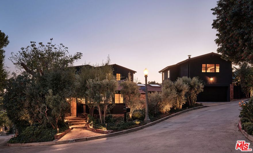 Newly reimagined by House of Rolison, this transitional-style character-filled home boasts five bedrooms and five and a half bathrooms. Step into the inviting great room with beautiful, vaulted ceilings seamlessly connected to the kitchen, living room, and dining room, creating an open-plan concept perfect for entertaining. Beyond its impeccable design, this home offers an array of features, including gorgeous city and ocean views, a built-in barbecue, pool, and a grassy yard. Ideal for entertaining, the layout of the house is accentuated by numerous secret doors waiting to be discovered, adding an element of intrigue and charm to the space. Enjoy the seamless transition from indoor to outdoor living, allowing for a harmonious blend of spaces. The property features an oversized three-car garage with an ADU above it, providing ample space for guests or additional living quarters. Retreat to the spacious primary suite adorned with high-end finishes, offering a luxurious sanctuary to unwind. Situated in the highly desirable crest streets of BHPO, this home truly embodies modern elegance and comfort.