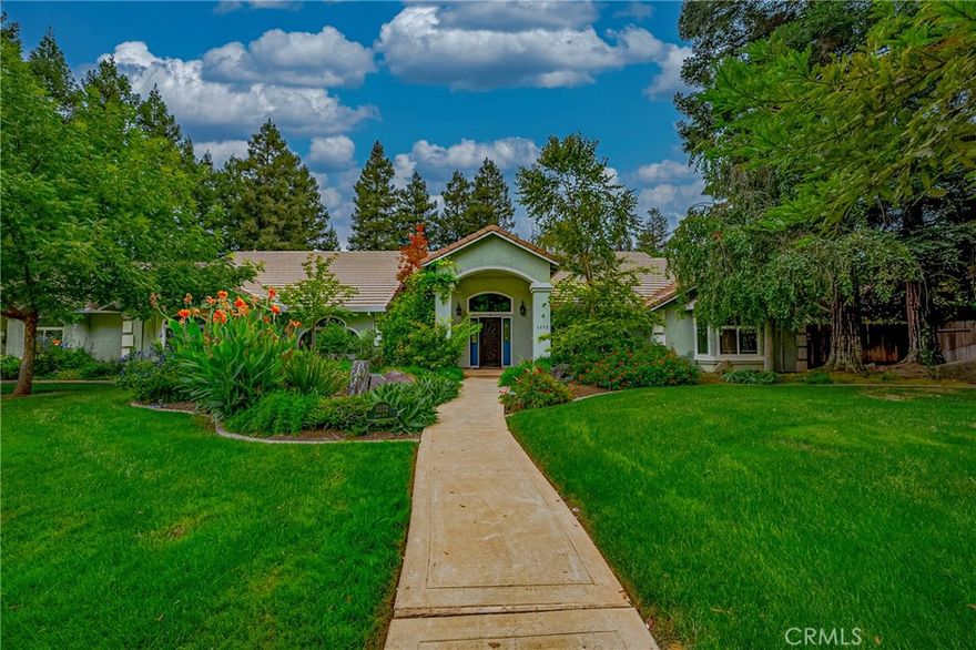 Welcome to your dream home in the highly sought-after Whispering Creek neighborhood of North Merced! This elegant 4-bedroom, 3-bathroom residence offers 3,264 sq ft of luxurious living space on a beautifully landscaped 1-acre lot, combining privacy, comfort, and style in one exceptional package. From the moment you arrive, you'll be captivated by the lush front yard, featuring mature landscaping and towering redwood trees that create a peaceful, secluded atmosphere. Inside, the entryway opens to a spacious family room with cathedral ceilings, a cozy gas fireplace, wet bar, and an open floor plan. The home is ready for your personal touch with concrete floors in various rooms, offering a blank canvas to install the flooring of your choice—whether it's hardwood, luxury vinyl, or custom tile. The gourmet kitchen is a chef’s delight, equipped with Thermador double ovens and 5-burner gas cooktop, center island, and a casual eat-in dining area that flows seamlessly into the family room—perfect for entertaining. Retreat to the expansive primary suite, offering enough room for a sitting area, office, or workout space. The en-suite bathroom features double sinks, a vanity area, separate tub and shower, walk-in closet, and private access to the backyard. Additional highlights include: a formal dining room, versatile sun porch, laundry room with sink and ample storage, sparkling in-ground pool, covered patio, gazebo, and storage shed and leased solar paid through September 2034. Enjoy the peace of country-style living just minutes from town, with quick access to shopping, schools, parks, and Campus Parkway. Don’t miss this rare opportunity to own a slice of tranquility in one of Merced’s most desirable neighborhoods.