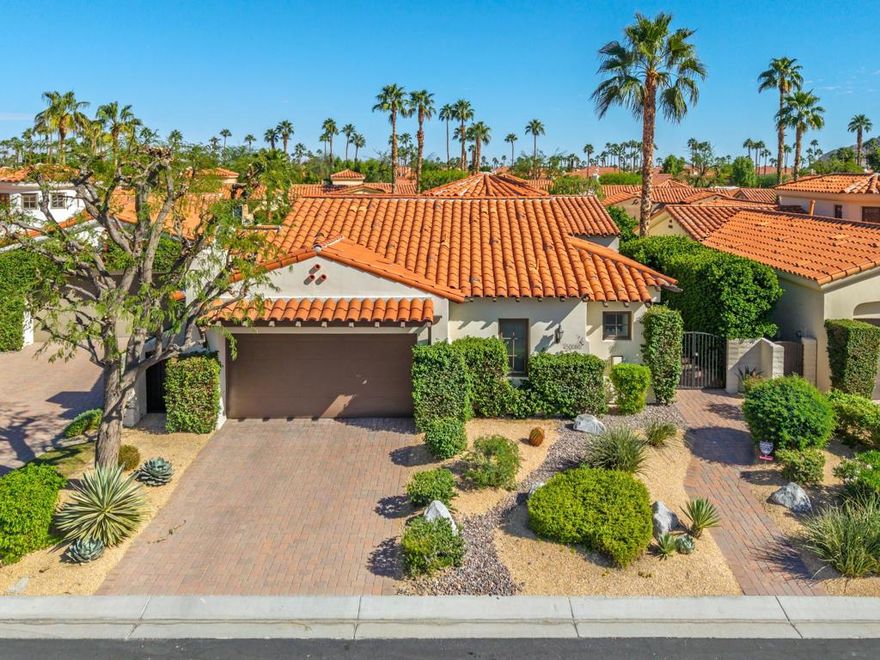 Fabulous gated location within the heart of La Quinta awaits you with this house! Open the gate and meander down the walkway to the beautiful arched entry. Foyer with soaring ceiling greets you. Formal Dining room is perfect for family or friends special events. Great Room flows into gourmet kitchen with circular granite counter, dry bar, and breakfast bar seating area. Wonderful area for entertaining! Casual dining area opens to the beautiful pool, spa area with mountain views plus delicious fruit trees. The Primary   bedroom suite offers a large spa-like bathroom with walk-in shower, soaking tub and two separate vanities. A large walk-in closet adds to this retreat. Private attached Casita has a fireplace, coffee bar area and bathroom . Guest suite with bathroom is ideal for visitors. Efficiently designed 'work at home'  space with built in desks and shelves is located in a quiet area of the house. Ideal for working away from the office.  Laundry room with  storage space makes this a perfect primary house or winter retreat.Two car garage, two new HVAC units, exterior trim painted and new electrical panel awaits the new owner!  Do not miss the  opportunity to own this pristine house that is being sold FURNISHED with few exclusions.