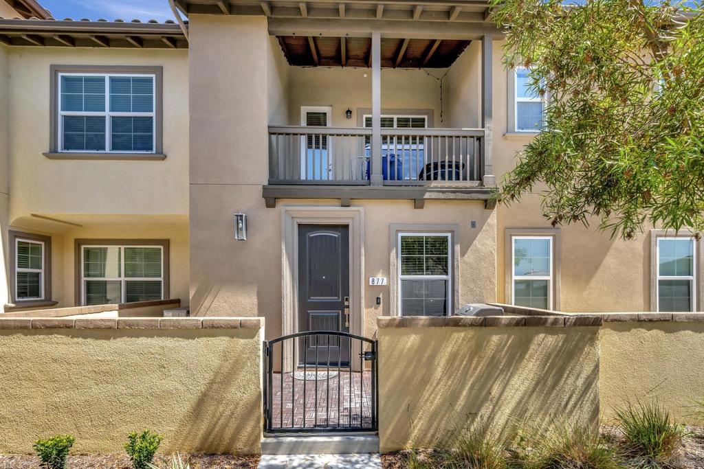 SOLAR powered townhome in the gated community of Rancho Tesoro in San Marcos! Welcome home to Skyhaus, a townhome community with resort-style amenities & sweeping VIEWS across the canyon from this unit off its' South facing balcony. Built in 2021, Skyhaus offers all the modern amenities you’d want in an townhome w/ an easy & low-maintenance lifestyle. Designed w/ comfort & functionality in mind, the main living space features an open floor plan between the kitchen & living/ dining areas with 2 full bed/ baths & indoor laundry all conveniently located on the 2nd level + a large entry-level room below perfect for a separate living room, home gym/ office or an optional 3rd bedroom. Interior upgrades include a chefs kitchen w/ quartz stone countertops, all stainless steel appliances w/ gas range & ample cabinetry, upgraded recessed lighting, Low-E windows allowing for tons of natural light throughout the interior & more! Other features include a 2-Car attached garage, tankless water heater, indoor stackable laundry for convenience + w/ the SOLAR system owned outright you’ll save thousands on energy costs every year! Rancho Tesoro allows its' resident access to to the prestigious ‘Bungalow’ community center & all its’ amenities including an olympic sized swimming Pool/ Spa, BBQ grills & fire pit area for outdoor relaxing & entertaining and the community neighbors the open space along the hillside & canyon w/ lots hiking & biking trails just walking distance from your front door. Also located conveniently close to great San Marcos schools for all ages, SMSU & Kaiser hospital, tons of great restaurants, shopping & entertainment, evrrything San Marcos offers! Skyahus is the epitome of modern, luxury, low-maintenance living. Come see for yourself.