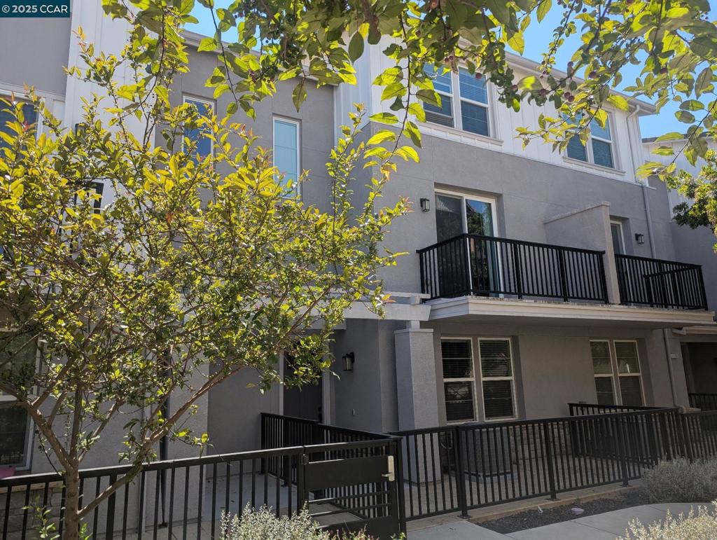 This stylish, NORTH facing, move-in-ready townhouse-style condo offers 4 bedrooms and 4 full baths, including three en suite bedrooms for ultimate comfort and privacy. The versatile layout is perfect for multi-generational living, guests, or a dedicated home office.The first floor features a private bedroom and full bath with walk-in closet—ideal for visitors or remote work. On the second floor, you’ll find an inviting open-concept living space with wood flooring, a bright living and dining area with balcony and a Chef's Dream kitchen equipped with a gas stove, stainless steel appliances, upgraded cabinetry and a spacious island. On this level is also a bed/office, full bath, and laundry room. The third floor has a generous primary suite with walk-in closet, dual vanities, and shower plus an additional bedroom en suite. The third floor hosts a generous primary suite with a walk-in closet, dual vanities, and a walk-in shower, plus an additional bedroom en suite. Located just .2 miles from Cottonwood Creek School, a little over a mile to Emerald Glen High School, and close to Fallon Sports Park, shopping, dining, freeway access, and major employers, this home blends convenience with modern comfort. A perfect blend of style, versatility, and location—ready for you to move right in!