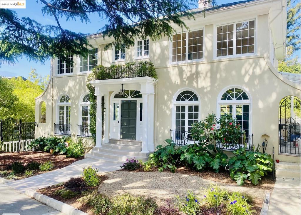 Spacious, bright with breathtaking SF Bay Views from all levels! This elegant Georgian style home graces the historic Upper Rockridge neighborhood, offering over 4,700 sq feet of flexible living space ideal for multi-group or generational living. The entry level features a grand entry, elegant arched windows all throughout, large living room with fireplace, open chef’s kitchen/dining room with a terrace and garage access, and powder room. The upper level features a well-appointed primary suite, two additional bedrooms, and hall bathroom, and a sunny library. The lower levels have separate entry and include 4th and 5th bedrooms (one staged as an office/home gym, and one is en suite), full hall bathroom with laundry, and a large theater/media room with fireplace, 2nd kitchen, den, and indoor-outdoor entertaining pavilion with hot tub, gas fireplace, patio heater, fireplace, and pizza oven, all overlooking the beautiful garden! Location is A+ and close to College Avenue/BART. Nearby schools include Chabot Elementary and College Prep.