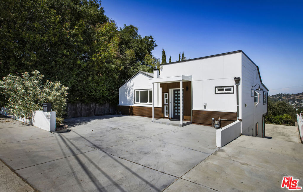This spacious two-story home offers 4 bedrooms, 3.5 bathrooms, and an additional large room perfect for a creative studio space, a home office or gym. Designed for both comfort and flexibility, the home sits on an expansive 7,000+ sq ft lot with room to live, work, and play.Upstairs, the primary suite opens directly to a private balcony, perfect for enjoying the fantastic views. Downstairs you'll find three additional bedrooms, providing separation of space for family or guests.The low maintenance yard offers endless possibilitiesthere may even be room for your own pickleball court.With its versatile layout, modern conveniences, and unique outdoor potential, this property is ready to fit your lifestyle.
