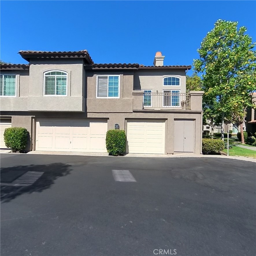 Beautiful 2 bedroom, 2 bathroom corner-unit condo in Aliso Viejo! This light-filled home features soaring ceilings, expansive windows, and an open floorplan. The kitchen offers stainless steel appliances and ample cabinetry, flowing seamlessly into the living and dining areas. Enjoy an oversized private patio with peaceful views. The spacious primary suite includes vaulted ceilings, walk-in closet, and en-suite bath with dual sinks and soaking tub/shower combo. Additional features include central air/heat, hallway linen cabinets, a large 1-car garage with extra storage, and assigned carport. Located in a great community walking distance to towncenter, near parks, greenbelts, pool/spa, shopping, dining, and easy freeway access.