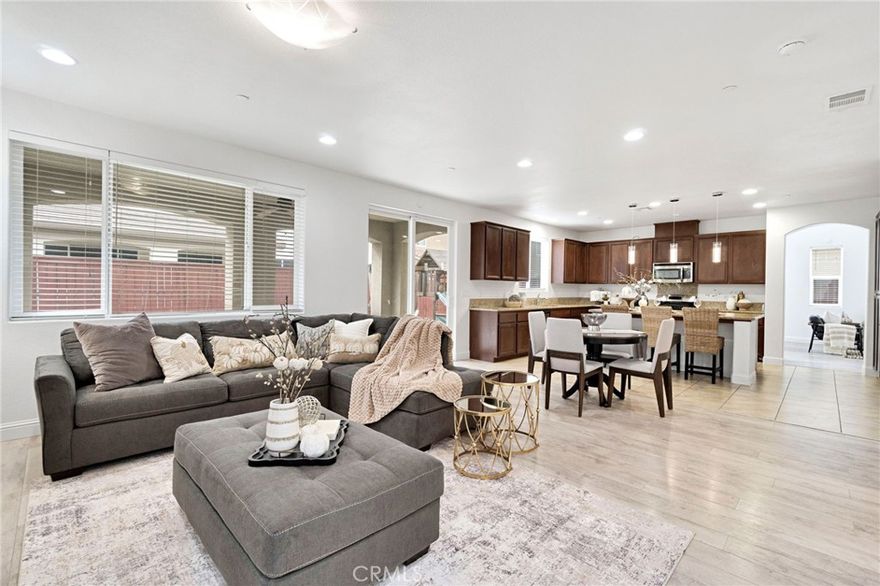 Price Improvement - Now Offered at $613,500! --- Freshly painted interior and professionally cleaned carpets set the tone for this move-in-ready home in Clovis' desirable Loma Vista community. Offering 4 bedrooms (2 masters), 4 bathrooms, a spacious loft, and two large living areas, this home was designed for both comfort and flexibility. Inside, enjoy high ceilings, ceiling fans throughout, and a bright open floor plan with spacious rooms and thoughtful flow. The kitchen features granite countertops, a large island, and a clean, open design that connects naturally to the main living room perfect for everyday living or entertaining. Upstairs, a private suite with its own bathroom provides an ideal setup for guests or multi-generational living. Outside, take advantage of a low-maintenance yard and a tandem 3-car garage with space for storage or a home gym. Conveniently located near parks, trails, and award-winning Clovis Unified schools, this home blends modern comfort, design, and practicality in one of Clovis' most sought-after neighborhoods.