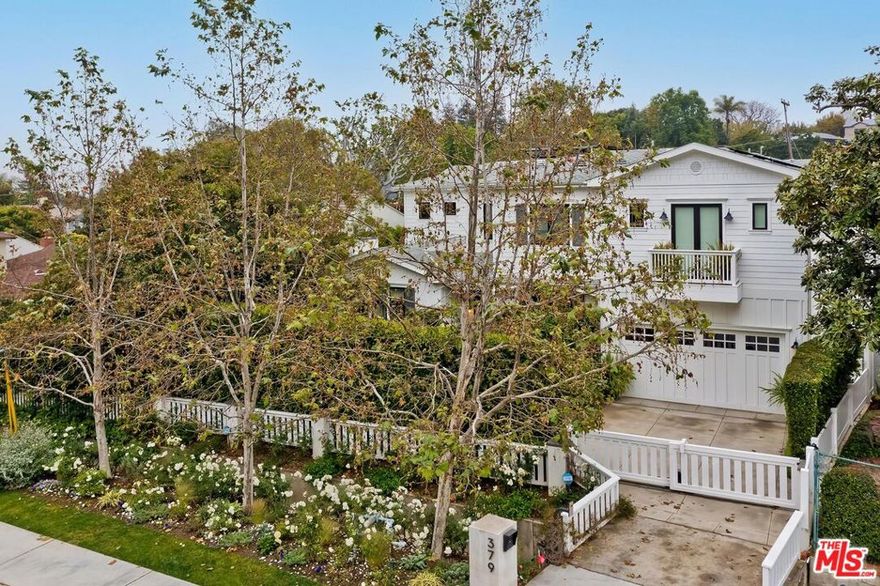 Gated and set back from the street, Ideally situated in the acclaimed lower Kenter Brentwood neighborhood, this 5 bedroom and 8 bathroom designer residence is what the market has been waiting for!  The first floor boasts of a gorgeous formal living room, dining room, Chef's kitchen equipped with top of the line appliances, open concept family room that is connect by sliding doors to a huge bonus room, guest bedroom w/ en suite bathroom, & direct entrance garage  access & mudroom. The family room is equipped with accordion folding glass doors that open to the spacious backyard & pool/spa area. Upstairs you will find (4) bedrooms all with en suite bathrooms. The remarkable primary suite encompasses a cozy fireplace, his & hers bathrooms,  (2) walk in closets & a private balcony.  You will also find a spacious laundry room equipped with a sink; ample counter space & built in storage. The turf grass backyard is fully lined with mature trees & Ficus to create a spectacular, private oasis. The patio space features alfresco dining and lounge area. The built in gas  Barbeque is perfect for outdoor entertaining,. There is also a pool house with fireplace & separate outside bathroom on opposite side of the yard. Added homeowner comforts include electric car charger, roof solar panels, built in speakers throughout the house & backyard,  tankless water heater, 2-zone HVAC with Nest thermostats, Ring camera doorbell along with a door/window/motion security system throughout the house. **Potted plants & mirror above bath in primary excluded **.