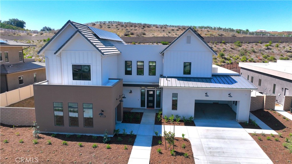 Imagine the happiness you will experience living in the 2025 Community of the Year! Experience the peace and tranquility of this spacious home built to the highest safety standards for your ultimate comfort and peace of mind. Enjoy the luxury of Primary Bedroom Suites on both the first and second floors for ultimate comfort and convenience with the highest levels of privacy. This home’s curated design blends warmth, texture, and modern simplicity, while touching on natural and earthy tones. The kitchen features a split cabinetry design, with stained sand-toned shaker cabinets throughout, adding a rich natural wood element, while the creamy Anew Grey shaker cabinets on the island create a striking focal point. Paired with elegant veined quartz countertops and a matching waterfall island and backsplash, the space feels refined and grounded.
The cohesive design extends into each bathroom with a blend of stone-inspired countertops, textured wall tiles, and organic flooring selections:
Primary baths include spa-like elements such as pebble-style shower floors, ribbed and stacked wall tiles, and soft neutral tones that create a calming retreat.
Secondary baths highlight linear wall tiles that balance timelessness and modernity. With a palette rooted in natural materials and minimalist elegance, this home offers a beautifully warm and contemporary living environment, paired with ample windows and natural light to help make your home your sanctuary.