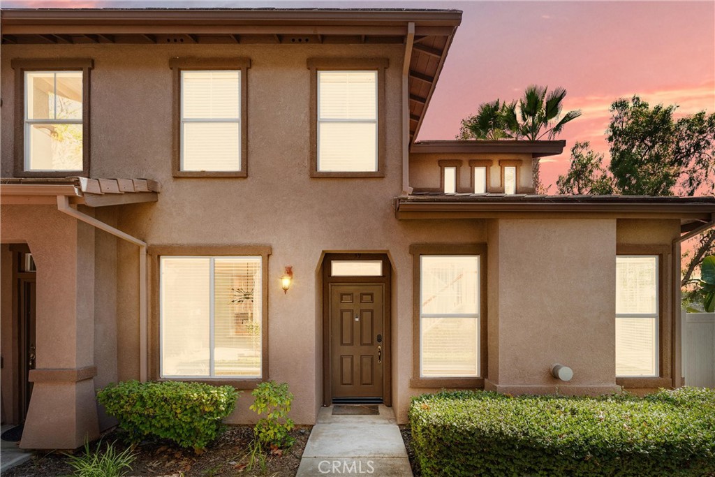 PREMIUM END UNIT WITH PANORAMIC VIEWS IN VISTA HEIGHTS! This upgraded 3 bed, 3 bath home sits on a PREMIUM LOT with no neighbors above or below, offering a spacious, low maintenance backyard and beautiful hill and city lights views. The thoughtfully designed floorplan includes open living and dining areas, and a stylish kitchen with quartz counters, single-basin sink, ample cabinetry, and a versatile flex space. A main floor bedroom and full bath provide the perfect setup for guests or a home office. Upstairs, the primary suite features a walk-in closet, dual sinks, a soaking tub, and shower, along with another bedroom and full bath. Additional highlights include beautifully refinished wood floors, an inside laundry, and direct-access 2-car garage. All this plus resort style community amenities including a pool, spa, clubhouse, and fitness center. In short, this is a GREAT place to call home that affords unmatched comfort and convenience with close proximity to top-rated schools, parks, scenic biking and hiking trails, a ton of shopping and dining options, SOKA University, and popular coastal destinations like Laguna Beach, Dana Point, and San Clemente.