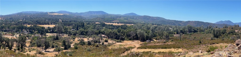 SECLUSION, BROAD VIEWSCAPE are obvious features of this 0.46 property made up of 4 separate parcels. No homes around to disturb you and 360 degree views of distant mountains including Seigler and Konocti. Gentle slope but elevated, with lots of rocks for landscaping. Room to do a well and a septic system, easy to solar. Make your own domain here, even though you are only a few minutes from local amenities.