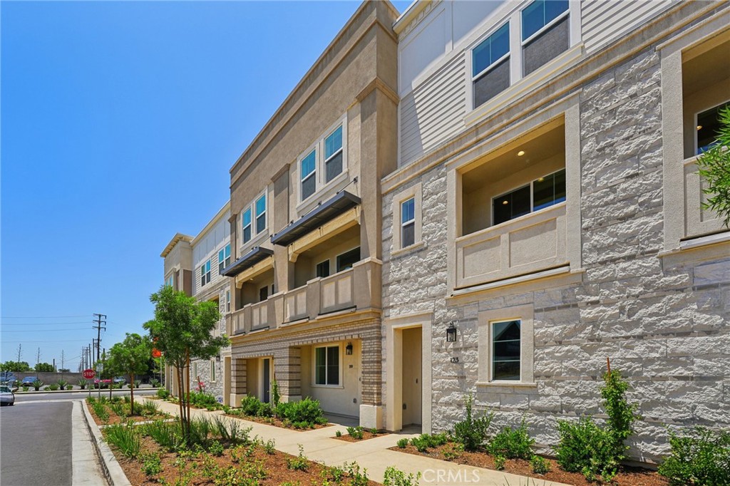 Move in ready - turnkey! Towns on First, City Ventures’ newest community of solar-powered homes in the heart of downtown Upland. Lot 5 includes 3 bedrooms plus entry level den with optional powder bath perfect for your home office or gym. Photos are of model home.