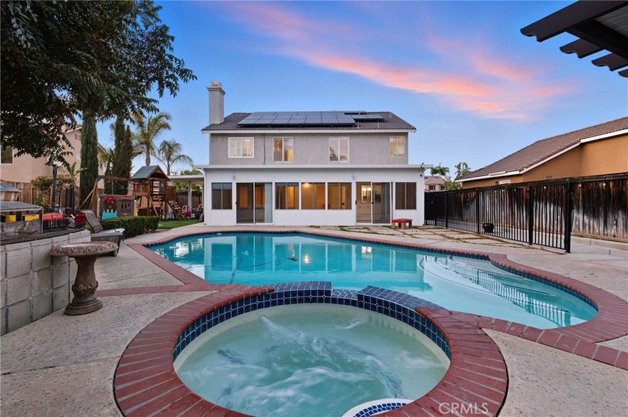 Stunning Turnkey!! POOL & SPA, 3 CAR GARAGE & RV Parking home with 17 SOLAR PANELS on a Cul-de-Sac in Prestigious South Corona's Mountain Gate Neighborhood. Santiago High School Zone. No Mello Roos, No HOA. OPEN FLOOR PLAN. Natural sunlight permeates this home which is upgraded from top to bottom. Luxurious wood flooring throughout. This 4 Bedroom 3 Bath plus Loft boasts State of the art appliances inside the Gourmet Kitchen. Smart home features galore. Energy efficient "HONEYCOMB" shades in Sunrooms. Two AC compressors will keep you cool powered by mother nature's Sun rays & Solar panels. Whole House Water Filtration System. Plantation Shutters throughout except in the Loft. Walk to Award Winning Eisenhower Elementary. Albertsons, Baskin Robbins ice cream, Banks and all shopping within Walking distance. Kid friendly backyard equipped with Jungle Gym and a termite resistant ALUMAWOOD covered Patio. Brand new built-in BBQ Station with roof and lights. Seller added legally permitted 374 sq.ft of living space which is pending public records update. This will not last!