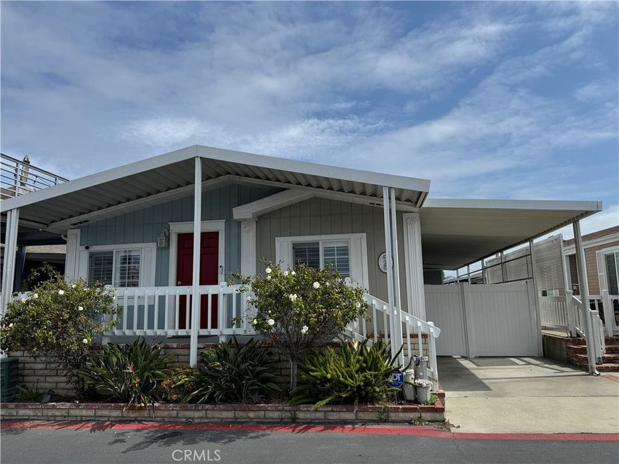 Beautiful West Coast Beach Lifestyle! Gated Community Across the street from the BEACH. Full Beach views and NO obstructions or home will ever be built in front of you. One of the last ones left! Fully remodeled beach cottage is quintessential coastal living at it's finest. Custom designer kitchen and baths, high end custom cabinetry, marble countertops, lighting and appliances. Home has newer porcelain plank woodgrain floors, crown molding and shiplap ceilings throughout. The front deck is the perfect space for relaxing and soaking in the UNOBSTRUCTED beach and Catalina views as well as the beautiful west-facing HB pier view. Great for whale watching and OC sunsets. New roof within the last four years as well as all new plumbing. New fencing with dog run and an EV station. Plenty of parking. Walk or ride your beach cruiser across the street for all the concerts, beach fun and Air shows, 4th of July fireworks and Catalina views. Fits two cars in driveway/Option to purchase additional parking spaces from park. Huge custom designed front and side deck plans w/Engineer/Architect already paid for. Will negotiate. Seller wants it SOLD. Willing to take $100,000 LOSS from what he put in property last year!!! Wants it SOLD!!! Community boasts a club house, Jacuzzi, Car wash, Heated swimming pool, game room and more. Dog parks on site along with a Spa and full gym. 24 hour security in gated community. Perfect vacation home or full-time residence.  Verifying space rent and will update.