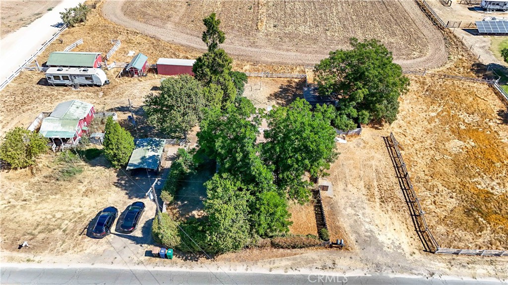 Incredible opportunity to own 5.35 acres spread across two separate parcels in a prime location. Whether you're seeking a serene horse ranch a multi generational family compound or a savvy investment with strong income potential this property offers flexibility to bring your vision to life. The property includes 2 homes the main House is a one bedroom one bath with a detached bedroom /utility room. The second home is a one bedroom one bath. Both homes are on one parcel. The property also offers a four horse stable a functioning outhouse and multiple storage buildings and a dedicated plot with its own irrigation system ideal for crops or pastures. Live, build and invest all in one property! Enjoy rural tranquility without sacrificing city access and take full advantage of the land's flexibility for agriculture, animals or generate income. Properties like this don't come around often. The possibilities are endless, Seller Financing available! Any and all pertinent details of property, should be verified with the appropriate county authorities for accuracy and compliance.