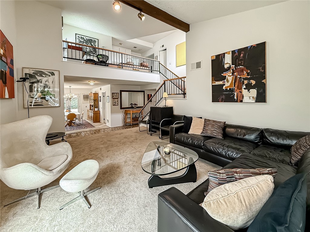 Dreaming of living in a friendly, idyllic, upscale community close to hiking trails, 10 minutes to Malibu, in the Award-winning LVUSD School District, close to Erewhon, Philz Coffee & great restaurants? Then this charming 4 bedroom, 3 bath home, with 2600 square feet of living space, a 3 car garage, a private 7756 square foot private, pool sized yard in the heart of sought after Saratoga Ranch is what you are looking for.
The dramatic, light-filled living room features vaulted ceilings and a large corner bay window. The spacious dining room features a large bay window as well and French glass doors leading you outside to the peaceful garden. The cozy open kitchen has updated quartz counters including a breakfast bar, a dining nook, hardwood floors, and it opens into a lovely den with a fireplace and French glass doors leading you outside to the covered patio and raised vegetable beds. The main floor has one full bath and one bedroom.
Upstairs you are greeted with a large open loft/office space in addition to 3 additional bedrooms and 2 baths. The primary suite has vaulted ceilings and a mantled brick fireplace. It has a huge walk-in closet and an additional large double closet. The primary bathroom has high ceilings, double sinks, tiled tub and floors.
This property is a true refuge surrounded by soul, charming nature, and mountain views!