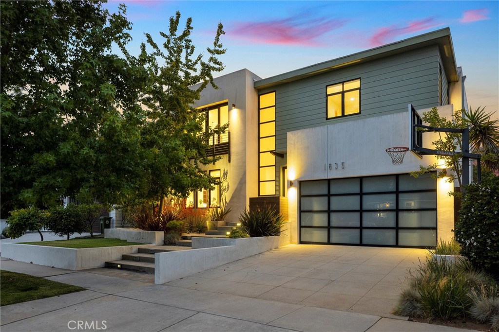 Welcome to 1635 19th in the highly sought after Liberty Village/Manhattan Heights neighborhood of east Manhattan Beach. A stunning architectural achievement and visionary reimagining of a classic California home, originally designed by architect Carol Cozen with 6 bedrooms, 4 bathrooms, and 3,428 sq. ft. of organic, modern, light-filled living. This home was built to accommodate a bustling household with style, comfort, and efficiency in mind. Sustainable bamboo wood floors throughout an open and seamless downstairs with an entertainer's dream kitchen with Sub Zero fridge, Viking stove and commercial hood, marble island countertops, beautiful maple cabinetry, tons of storage space that blends into an open and bright living space with exposed wood, metal trusses, and floor-to-ceiling windows. Relax or entertain in the private backyard with built-in fire pit, kitchen, bar seating, and tranquil fountain. A full laundry room, powder room, bedroom, bathroom, and flex bedroom/bonus room complete the downstairs. Thoughtfully designed, the upper level is split into private wings greeted at the top landing by an impressive maple bookcase. The primary suite is nothing less than serene with ample trees highlighting the massive sliding doors to the Juliet balcony, dual walk-in closets, en-suite primary bathroom with dual sinks, separate water closet, walk-in marble shower, and soaking tub. Opposite the primary suite wing, three additional bedrooms and a full bathroom await residents or guests. Is this the most highly desirable traditional neighborhood in MB? You decide! In the same neighborhood and just minutes from Meadows Elementary, Manhattan Beach Middle School, the famed Polliwog Park, and less than two miles to Downtown Manhattan Beach. This is a home you must truly see for yourself!