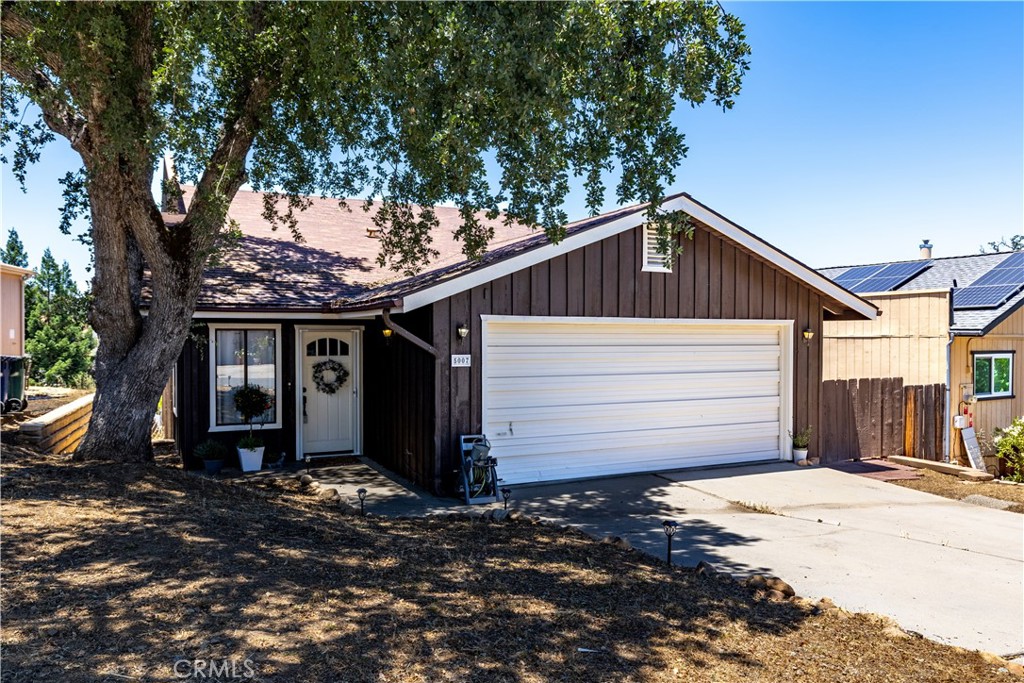 This spacious split level home has 2 bathrooms/2 bedrooms + a bonus room with a murphy bed. A portion of the double car garage has been converted to the bonus room while still leaving plenty of space for storage and a boat or car. There are 2 sliding doors that open up to the full length back balcony that extends from the living room to the kitchen eating area. Whether out on the balcony or inside you can enjoy views of the tree covered hills. The large kitchen has stainless steel appliances and a brand new dishwater. Laundry room and guest bathroom are also located on the main level. The primary bedroom with ensuite and guest bedroom are on the lower level. The backyard has access from the street behind the property if you interested in storing your boat in the backyard. Come take advantage of Lake Nacimiento and all Heritage Ranch community has to offer. Located only 20 minutes from downtown Paso Robles and award winning wineries. Assumable 4.75% FHA loan available!