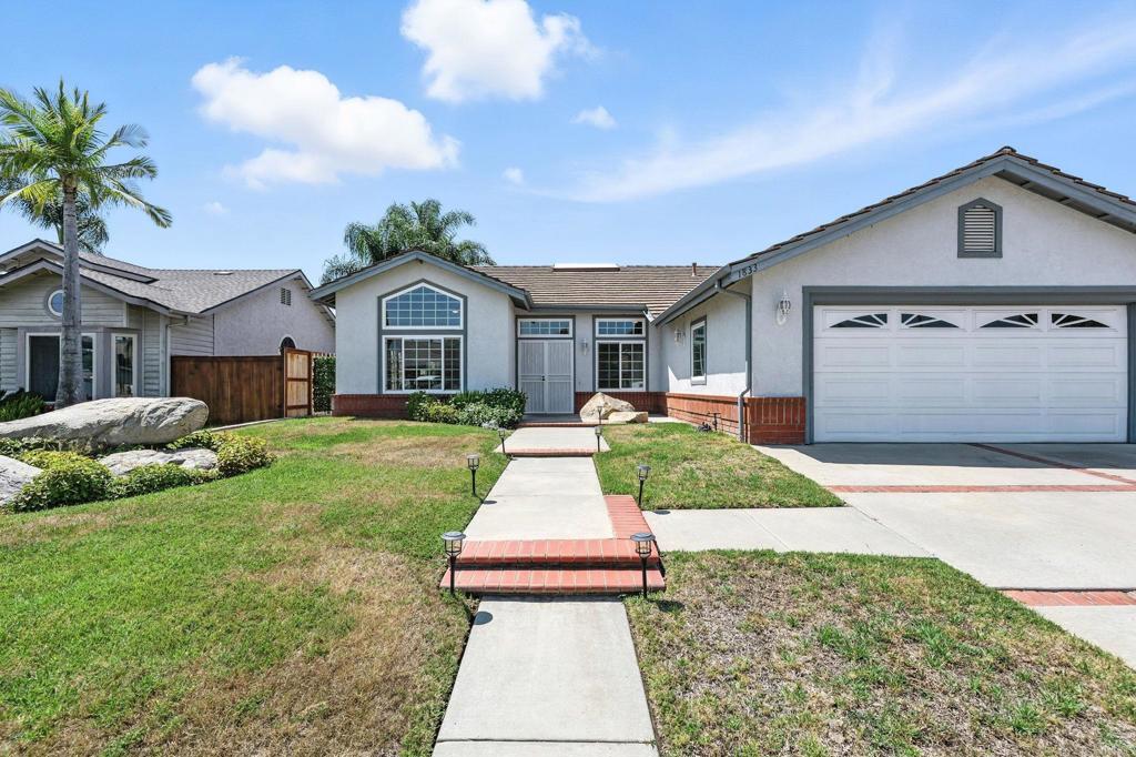 Welcome to this spacious and beautifully maintained single story home in the desirable Escondido Country Club neighborhood! This single story 3-bedrooms with an upstairs loft, 2-bathroom property offers an open and airy floor plan with vaulted ceilings, dual pane windows, and modern interior light fixtures throughout. The living room is filled with natural light thanks to a skylight and features a cozy gas fireplace and French doors that lead to the backyard. The kitchen is equipped with granite countertops, a gas stove, refrigerator, microwave, and dishwasher perfect for home chefs. Enjoy the convenience of indoor laundry with a sink, cabinets, and included washer and dryer. The large primary suite features a walk-in closet, dual sinks, and a separate tub and shower. French doors in the family room add additional access to the backyard. The expansive backyard is equipped with two patio covers and provides scenic hill views—ideal for entertaining or relaxing outdoors. Additional highlights include new light fixtures and ceiling fans, an upstairs loft space perfect for a home office or play area, and gated side parking with room for a work truck, boat, or desert/water toys. Don’t miss the opportunity to live in this sought-after community!
