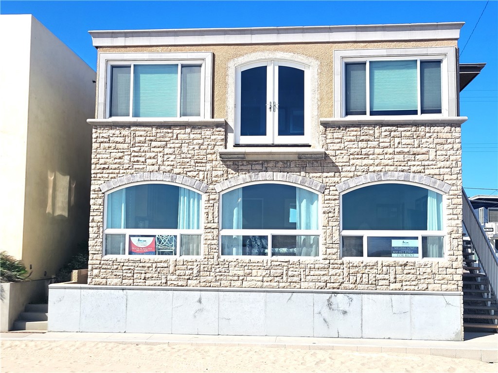 Discover coastal living at its finest in this beautifully furnished, first-floor beachfront unit offering stunning ocean views in the fall and spring. Ideally located just a short stroll from the pier and Main Street’s vibrant restaurants and shops, this charming residence spans approximately 900 square feet and features three bedrooms, one remodeled full bathroom, and sleek laminate flooring throughout. The remodeled kitchen comes fully equipped with a stove, dishwasher, refrigerator, and microwave, flowing seamlessly into a cozy dining area. The spacious living room is highlighted by wall-to-wall windows that frame breathtaking views of the beach and ocean. Additional conveniences include one covered carport space, onsite laundry facilities, and included utilities such as water, trash, Wi-Fi, and basic cable. Perfect for those seeking comfort, style, and an unbeatable beachfront location.