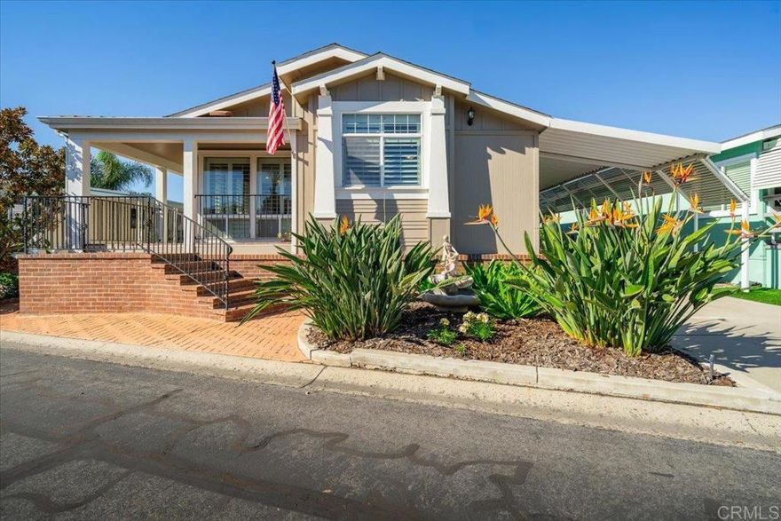 Beautiful 3BD/2BA 2007 manufactured home in Rancho Carlsbad’s desirable 55+ gated community! Land owned with permanent foundation and 433A documentation included for loan application approval.  Turn-key and move-in ready, this home features hickory hardwood floors, vaulted ceilings with SolaTube skylights, granite countertops, plantation shutters, customized primary closet, brand-new LED lighting, ceiling fans, newer appliances including refrigerator, dishwasher, microwave, washer/dryer, reverse osmosis drinking water, and a freshly painted interior. Energy-efficient upgrades include a new tankless water heater, reinforced post-and-pillar foundation, updated venting, ductwork, vapor barrier, sewer clean-out, and Nest thermostat. Enjoy a landscaped yard with sprinklers, private patio, mature fruit trees, storage shed, and security cameras. Ideally located within walking distance to the pool, hot tub, gym, and community amenities. Low HOA dues cover all of the following: internet, gas, electricity, water, sewer, and trash collection service. Pride of ownership shows throughout this exceptional home!