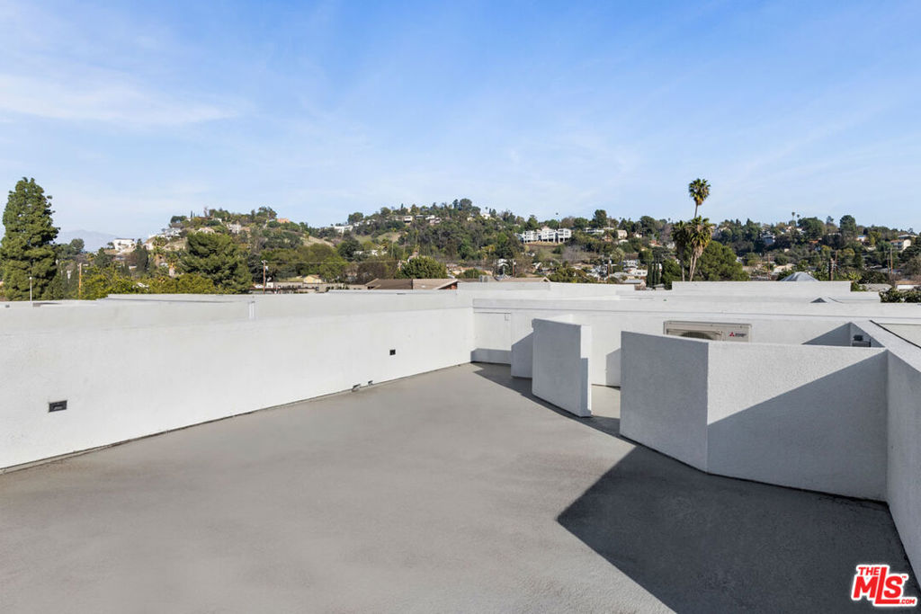 Special offer, one month free with the signing of a one-year lease agreement. Contact sales for details. Available for lease, this newly built single-family home delivers modern, light-filled living with an oversized rooftop deck capturing mountain views in vibrant Glassell Park. The open-plan great room connects the living, dining, and kitchen zones, where a stainless-steel Frigidaire appliance suite and ample storage make meal prep effortless. Three en-suite bedrooms include a primary suite with a spacious closet and a sleek, modern bath. Hard surface flooring adds warmth, and oversized windows maximize natural light. Start your day with coffee on the balcony, then unwind on the rooftop deck, dining al fresco as the sun sets. Conveniences include an in-home washer and dryer, HVAC, and a two-car garage. Located near Lemon Poppy Kitchen, The Habitat, and commuter routes to Glendale, Burbank, Hollywood, Pasadena, and Downtown LA.