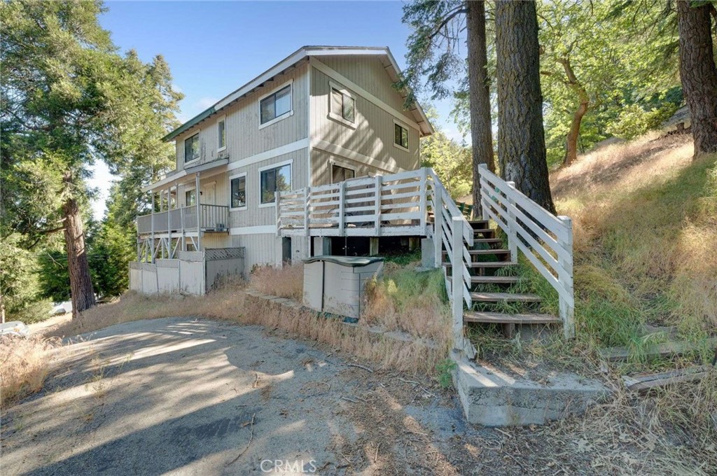 **Discover Your Mountain Retreat in Twin Peaks – A Perfect Blend of Privacy, Views, and Comfort**
Imagine waking up each morning to breathtaking vistas of Mount Baldy and Lake Gregory, right from your front porch. Nestled on a coveted corner lot in the charming community of Twin Peaks, this beautifully maintained home offers a harmonious blend of natural beauty, thoughtful design, and versatile living spaces.
Step inside and be greeted by an open tri-level layout that’s ideal for both intimate gatherings and lively larger get-togethers. The spacious, well-appointed kitchen boasts butcher block countertops and a charming window overlooking the backyard—perfect for preparing meals while enjoying the peaceful outdoor scenery. Multiple decks extend from the home, providing ample spots to sip your morning coffee, unwind with evening wine, or simply soak in the scenic surroundings.
The large master bedroom is a sanctuary with a cozy fireplace and a luxurious en-suite Jack and Jill bathroom—an inviting retreat after a day of exploring. The home’s abundant natural light filters through the windows, illuminating the warm laminate floors and creating an inviting atmosphere throughout.
Entertainment and flexibility are at the heart of this property. A dedicated theater room offers the perfect space for movie nights, while the lower level features a versatile area with a separate patio, ideal for guest accommodations or a private workspace. Two fireplaces—one in the master and another in the living room—add warmth and charm.
Parking is never a concern with multiple driveways that comfortably hold 5+ vehicles, making hosting friends and family effortless. The property also comes fully furnished, including all bedrooms, living room furniture, and appliances—just bring your suitcase!
Additional features include hardwired preparations for a generator, a laundry area on the lower level, and plenty of space for outdoor enjoyment. While the exterior may need some love due to weathering, the location offers unmatched serenity and stunning scenery—an incredible opportunity to create your personal mountain paradise.
Whether you’re seeking a peaceful retreat or a lively gathering spot, this Twin Peaks home combines comfort, convenience, and captivating views in one perfect package. Don’t miss your chance to own this exceptional property—your mountain escape awaits!