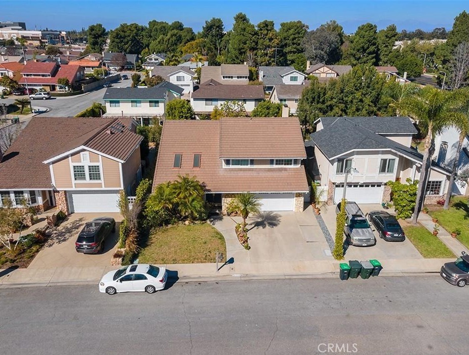 Single Family Residence on a cul-de-sac street, located in arguably the best locations in Costa Mesa! This two-story home has 4 bedrooms upstairs, each is oversized with high ceilings and natural lighting. The master bedroom has a fireplace with large master bathroom comprised of dual sinks, custom cabinets, 2 closets and one of which is a walk-in closet, soaking tub and walk-in shower. This traditional home has a formal living, dining, and family room with new wood flooring throughout, tile flooring and carpet, large skylights, recessed lighting, crown molding, baseboards, custom window coverings with double panned windows and sliding doors. The kitchen has custom cabinets, soft close pull-out drawers, granite countertops with stainless steel appliances, a six gas burner Thermador oven, and a range top and is open to both the living and dining room area. The backyard is spacious and serene, with plenty of grass and privacy. The house is conveniently located only two blocks away from South Coast Plaza, the public park, major freeways (73,55,405), restaurants, coffee shops, and nightlife!