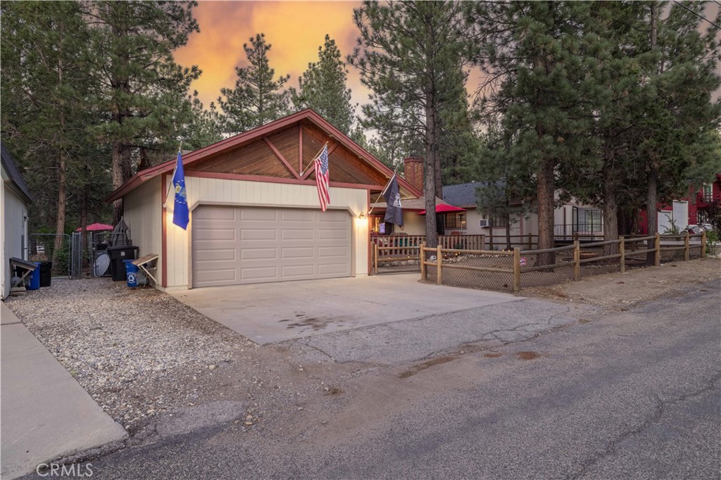 Discover mountain living at its best in this charming 4-bedroom, 2-bath home in the most desirable part of Erwin Lake. Built in 1983, this single-story home features vaulted ceilings, an open floor plan, large bedrooms, and abundant natural light. Enjoy a cozy wood-burning stove, functional kitchen, spacious bedrooms, and a large front deck perfect for relaxing. The fully fenced yard (both back and front) is ideal for kids, pets, and outdoor fun, and the oversized 2-car garage offers ample storage. Located near hiking, biking, and off-roading trails, this home is a perfect year-round retreat or vacation escape. This is one you don't want to miss!
