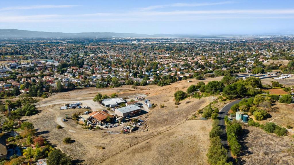 Unwind in your private 8-acre Berryessa Hills oasis! Enjoy stunning panoramic Silicon Valley views from every window of this charming 3BR/2BA home (3347 sqft, buyer verify). Zoned for agriculture, the property features a barn and spacious workshop (approximately 3300 sqft), ideal for pursuing your hobbies or business ventures. Embrace self-sufficiency with a natural spring and well on-site. This property is being sold AS-IS with possibilities to build on the current footprint. Don't let this rare opportunity slip away!