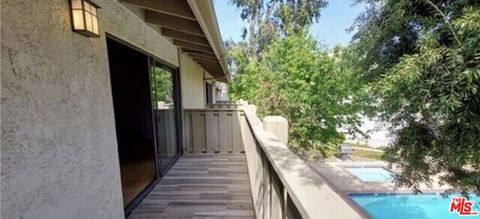 Photo of 18433 Hatteras Street #207, Tarzana, CA 91356 (MLS # 26662869)