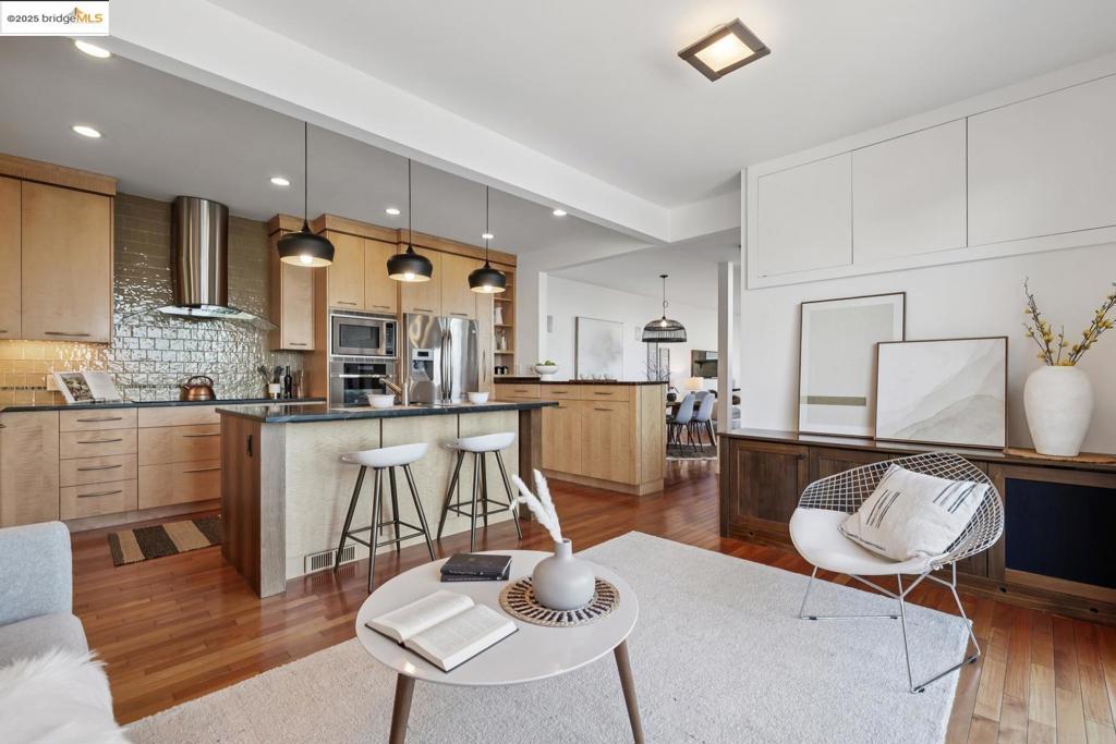 Perched above the city with breathtaking views of the Bay, Golden Gate Bridge, and SF skyline, this contemporary sanctuary offers more than just a home — it’s a way of life. Flooded with natural light through brand-new windows and motorized shades, the primary suite and main living areas frame the dramatic beauty of the Berkeley Hills. The main level features a comfortable, open layout that flows naturally from the living room to the kitchen and dining area — ideal for both relaxed evenings and effortless entertaining. The gourmet kitchen is finished in exotic woods and bronze countertops, creating a unique blend of sophistication and style. Recent upgrades also include a newly installed sump pump system, offering peace of mind and protection. Nestled on the edge of Tilden Park, you’re minutes from miles of trails, top-rated schools, downtown Berkeley, BART, and the SF commute — but you'll feel worlds away. If you’re looking for something soulful and deeply connected to both nature and design — THIS IS IT!