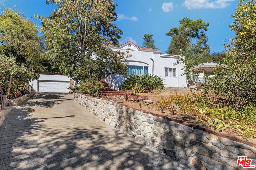 DEVELOPER & BUILDERS OPPORTUNITY!  Huge lot with 34,655 sq. ft.  Discover your new lifestyle in this two-story home situated on a fabulous neighborhood in Eagle Rock.   Beyond the verdant trees is a Traditional combined with modern style retreat from the city.  Upon entry, you are greeted by warmth and inviting foyer.  Enjoy gatherings in the generously-sized living room and formal dining room that opens to the backyard.  Renovated kitchen with quartz countertops, tile flooring, stainless steel appliances, built-in oven, farmhouse sink and beautiful custom white lacquer cabinets.  The first floor offers a primary bedroom with ensuite shower, 2 additional bedrooms and full bathroom in the hallway with double vanity & soak in tub.  Laundry room is conveniently located on the main floor.  On the upper level, a ballroom awaits where you can entertain in grand style featuring  French doors that open to the wraparound balcony where you can enjoy the views.  Hardwood floor and natural light abound throughout the space.   Additional 2nd ensuite consists of  tastefully designed full bath with marble walls, floors and vanity.  Another spacious bedroom and a  full bath with separate soaking tub and shower on this floor.  Minutes to the vibrant downtown Eaglerock where trendy restaurants, vintage shops and thriving arts scenes along Colorado Blvd.  Close proximity to schools, Downtown Los Angeles (Dodger Stadium), Glendale (Americana at Brand) and Pasadena (Rose Bowl).  Come and check out this Eclectic Vibe community.