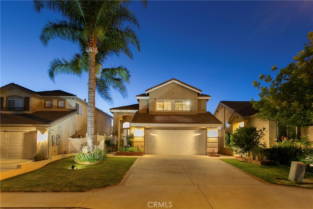 The home everyone wants to go to. Nicely nestled on a quiet cul-de-sac, high in the hills of Anaheim. Spectacular views enjoyed from the kitchen, living room, family room, primary bedroom and backyard, while lounging on the deck, relaxing in the Jacuzzi or gathering around the fire pit. Enter into the living room with high ceilings for that large open feel. Kitchen opens to the family room with wonderful flow to the backyard for exceptional indoor/outdoor entertaining. The spacious Primary bedroom offers gorgeous views, a beautiful ensuite bathroom and viewing deck. Two secondary bedrooms and a secondary bath complete the upstairs. The backyard is well set up for entertaining with a well positioned pool with Baja-step, an elevated Jacuzzi to enjoy the views, built in fire pit and plenty of space for seating. The two car attached garage offers abundant storage and car-charger. Newer solar panels provide lower energy costs. Inside laundry. Top-rated schools. A wonderful neighborhood close to restaurants, shopping, parks, golf, entertainment, and easy freeway access. Quiet neighborhoods, beautiful hills and a constant breeze all provide that feeling of being away from it all while still being close to so much. A truly wonderful place to live.