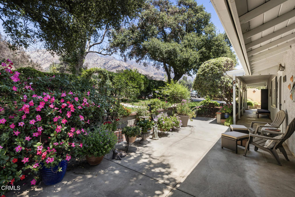 Tucked away in a peaceful Altadena neighborhood, this charming residence offers the perfect balance of privacy and comfort. Step inside to a spacious living room bathed in natural light, featuring a cozy fireplace and sliding glass doors that open to lovely patio areas that enjoy views of the San Gabriel mountains. The formal dining room is off of the well designed kitchen which offers generous cabinetry, counter space, a built-in desk nook, and a convenient in-cabinet laundry area. The home features two comfortably sized bedrooms, one with a large walk-in closet and the other with sliding glass doors leading out to a patio. Recent upgrades provide value and peace of mind: newer roof on house and garage (2022), tankless water heater (2024), plus brand new attic insulation , all new HVAC ductwork, and a professionally cleaned interior/exterior that were all completed (2025). Additional amenities include central air and heat, a detached two-car garage, and landscaped grounds anchored by beautiful, mature Oak trees.